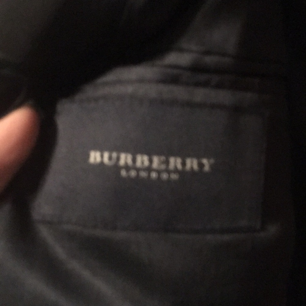 Burberry London man coat with logo on buttons silver color navy blue.